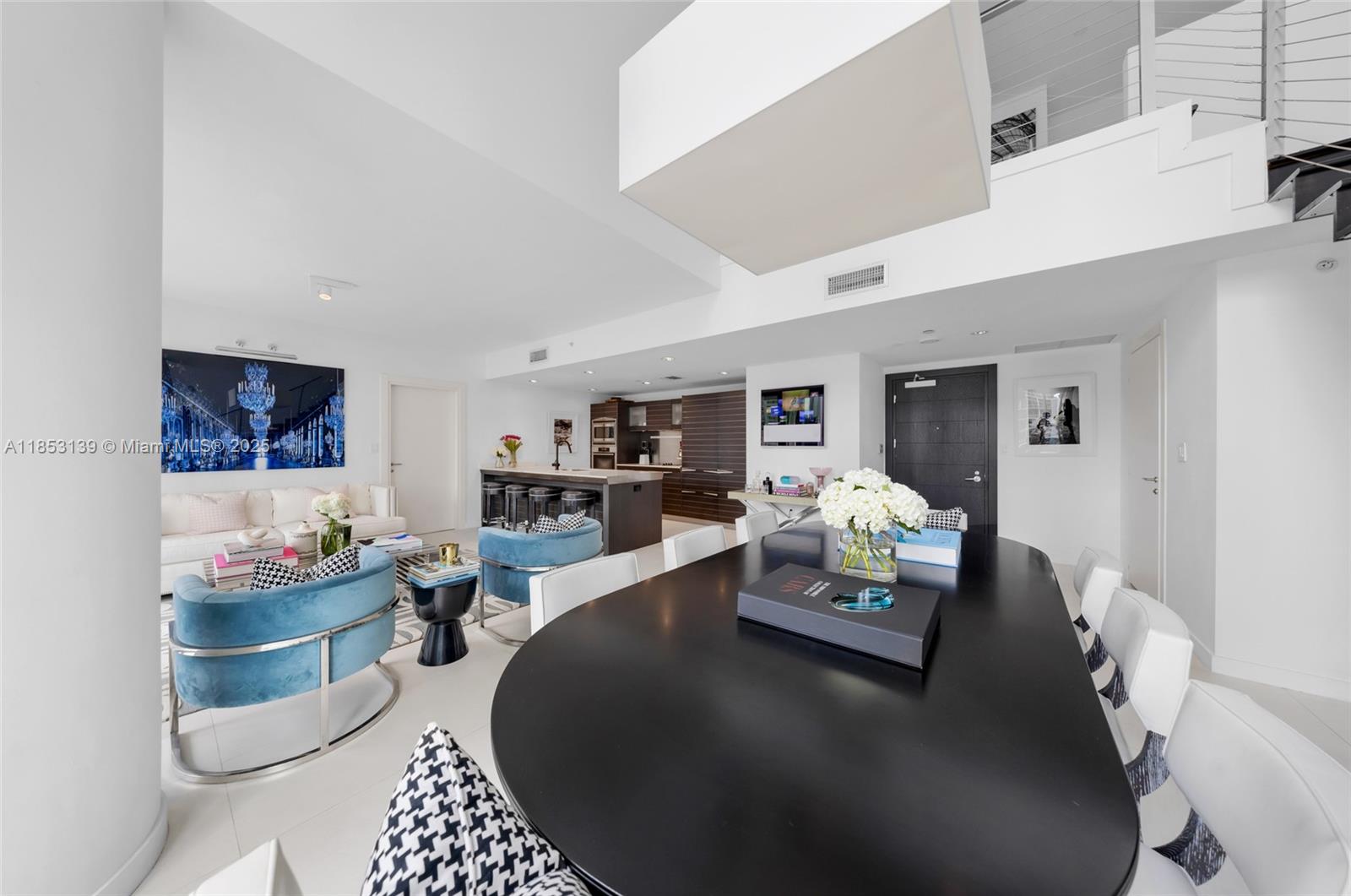 200 Biscayne Blvd Way, Unit 904 Miami, FL 33131 - Photo 8 of 24 a living room with furniture and a table