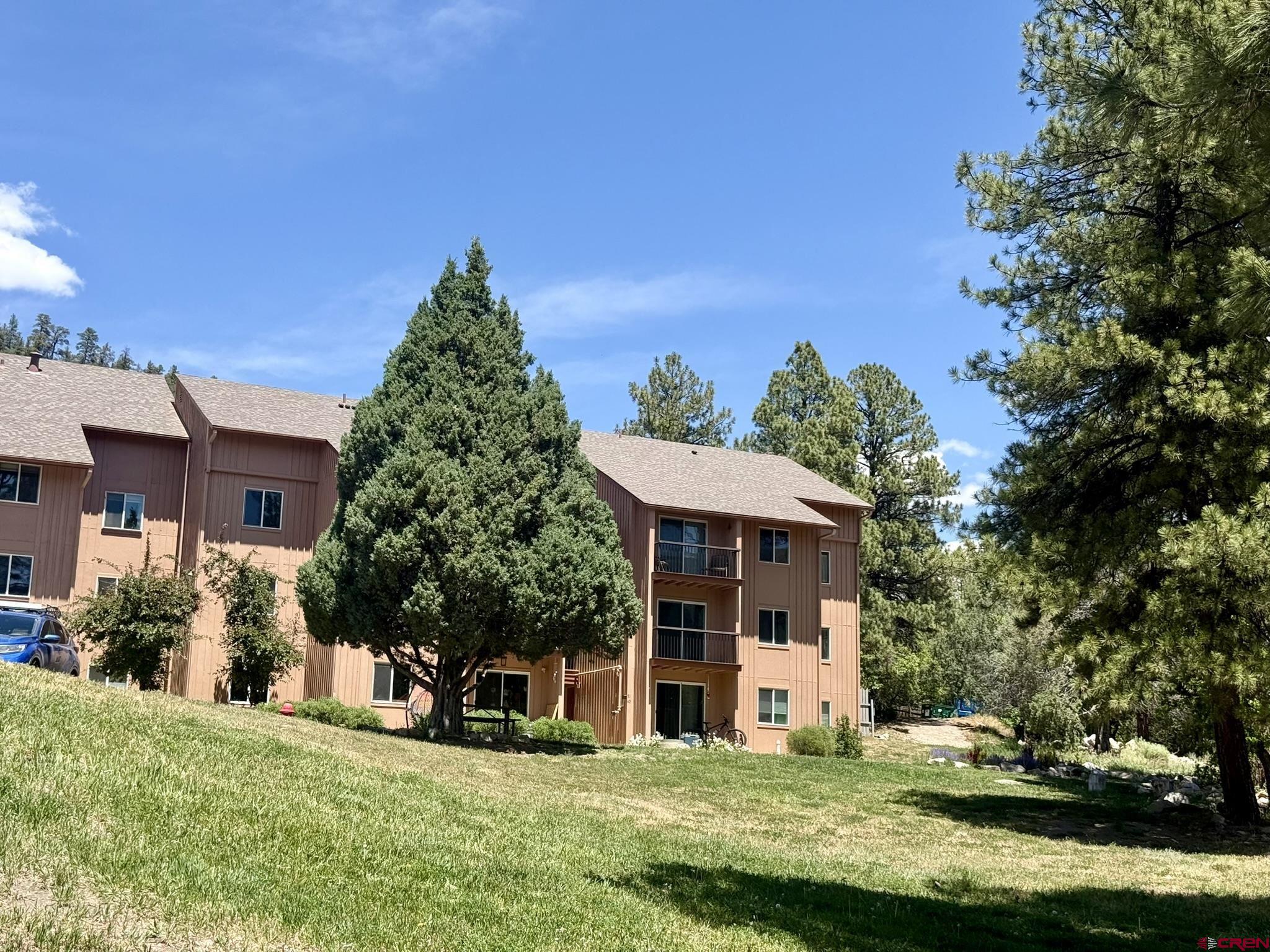34237 Highway 550, Unit 27 Durango, CO 81301 - Photo 1 of 45 a front view of a house with a yard