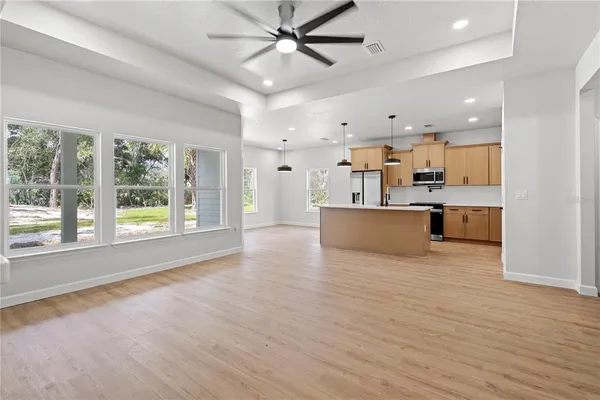 a kitchen with stainless steel appliances a sink stove and refrigerator