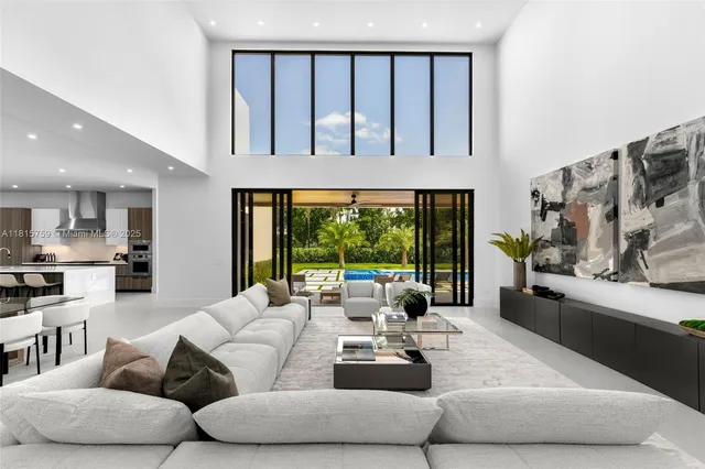 a spacious bedroom with a large bed and a large window