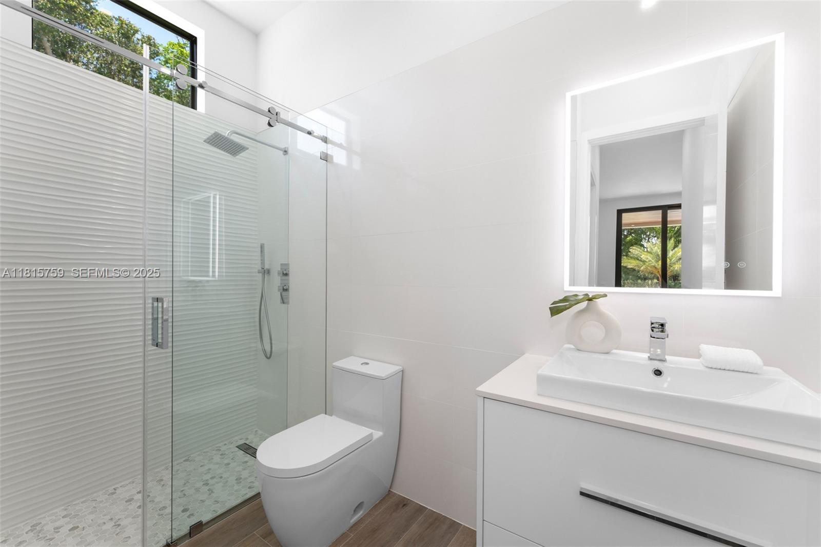6200 Moss Ranch Road Pinecrest, FL 33156 - Photo 23 of 58 a bathroom with a sink toilet and shower