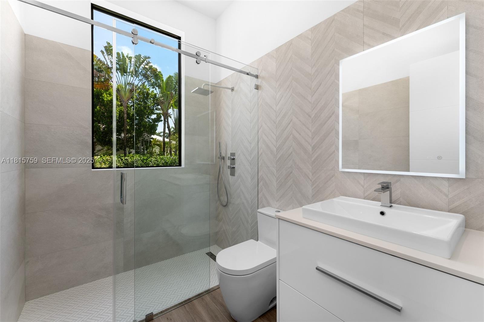 6200 Moss Ranch Road Pinecrest, FL 33156 - Photo 25 of 58 a bathroom with a sink toilet and shower