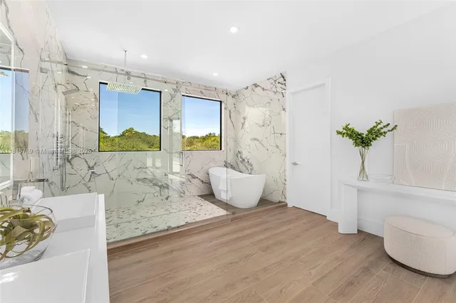 a view of a patio with couches and pool