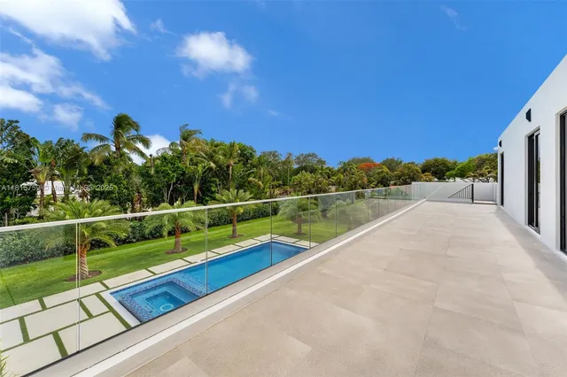 a kitchen with a stove top oven and sink