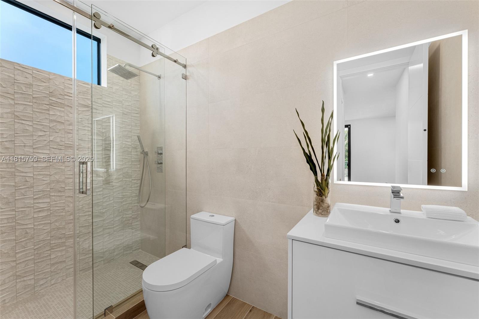 6200 Moss Ranch Road Pinecrest, FL 33156 - Photo 36 of 58 a bathroom with a toilet sink and shower