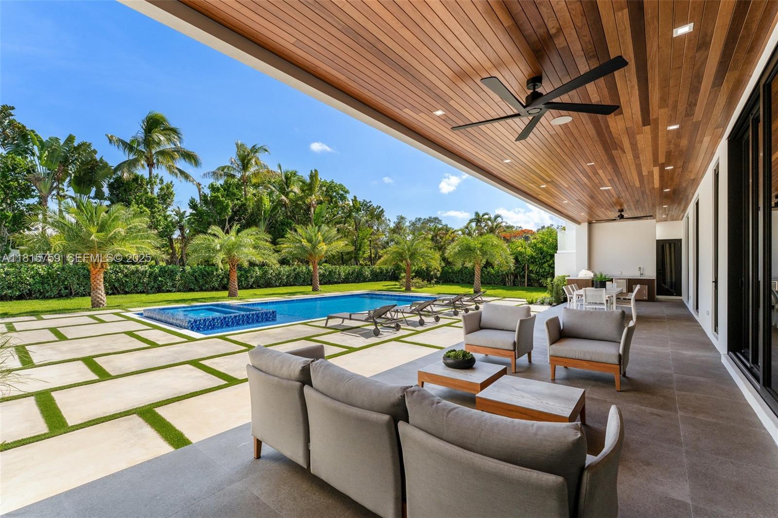 6200 Moss Ranch Road Pinecrest, FL 33156 - Photo 38 of 58 a view of a patio with couches and pool