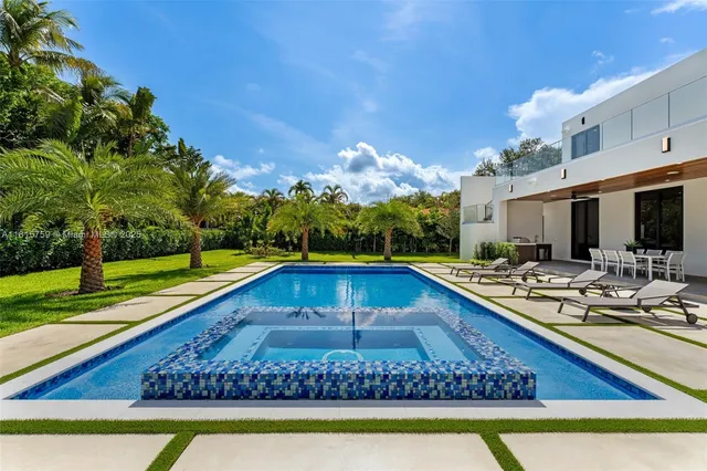 an aerial view of a house with a garden