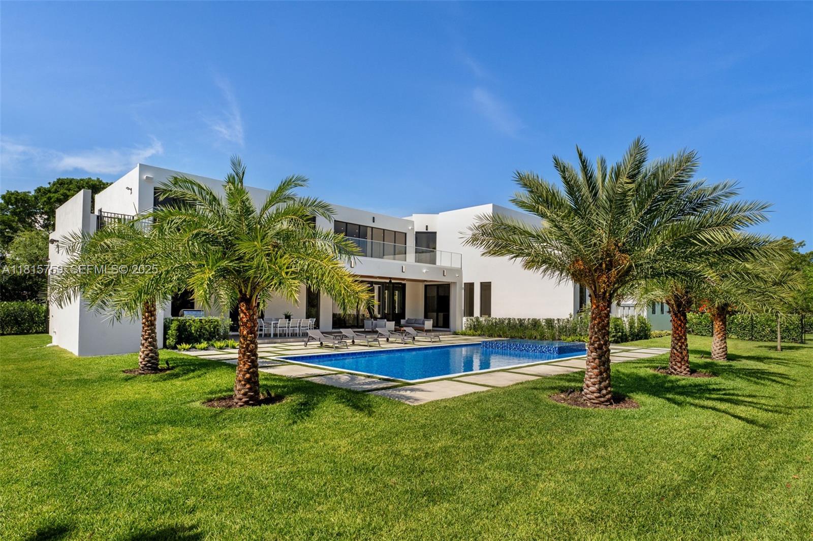6200 Moss Ranch Road Pinecrest, FL 33156 - Photo 43 of 58 a house with palm tree in front of it