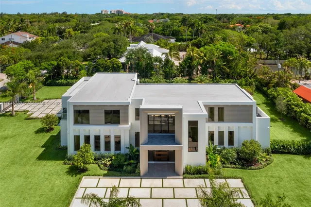 a living room with furniture city view and large windows