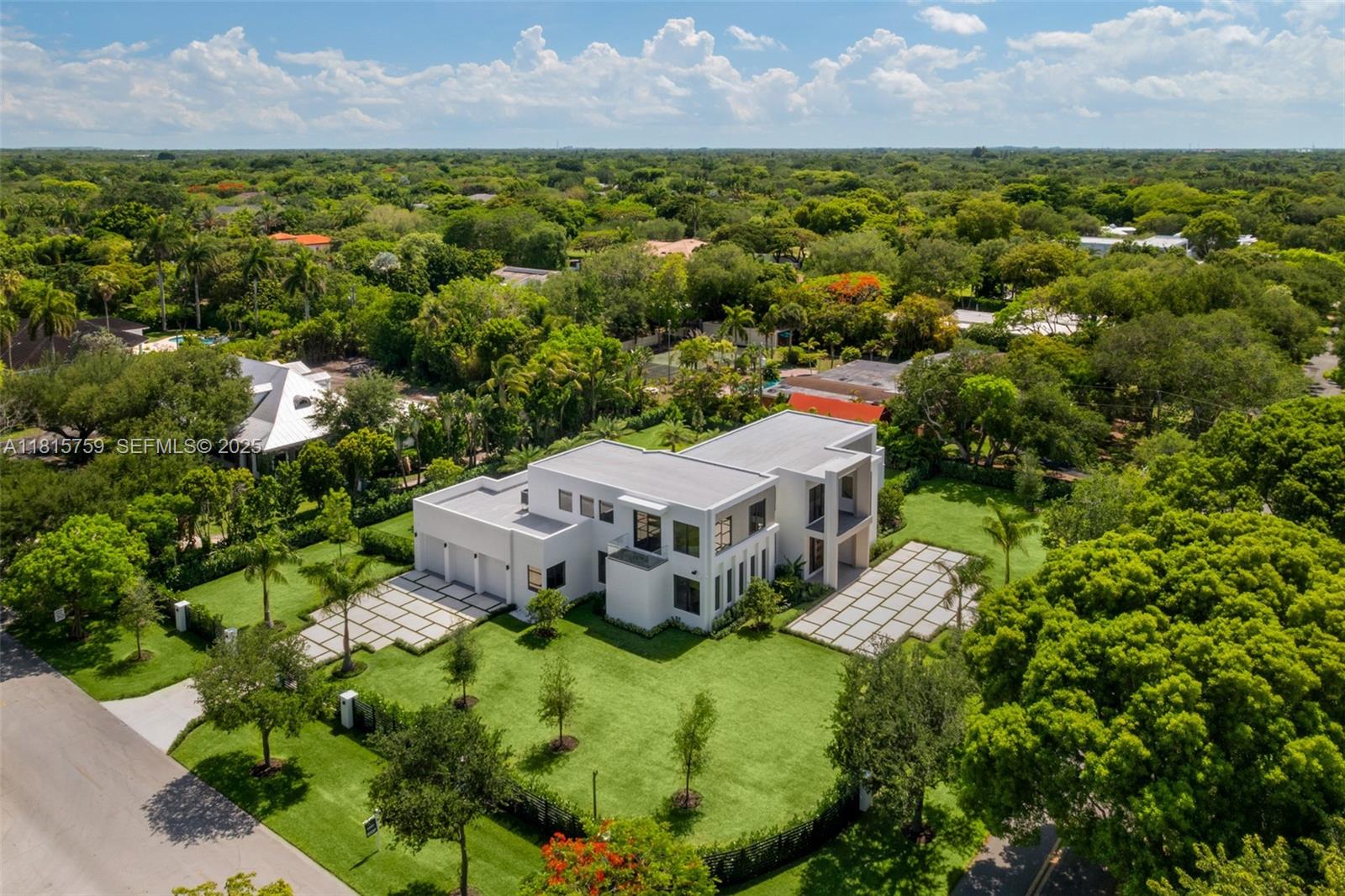 6200 Moss Ranch Road Pinecrest, FL 33156 - Photo 48 of 58 an aerial view of a house with a yard