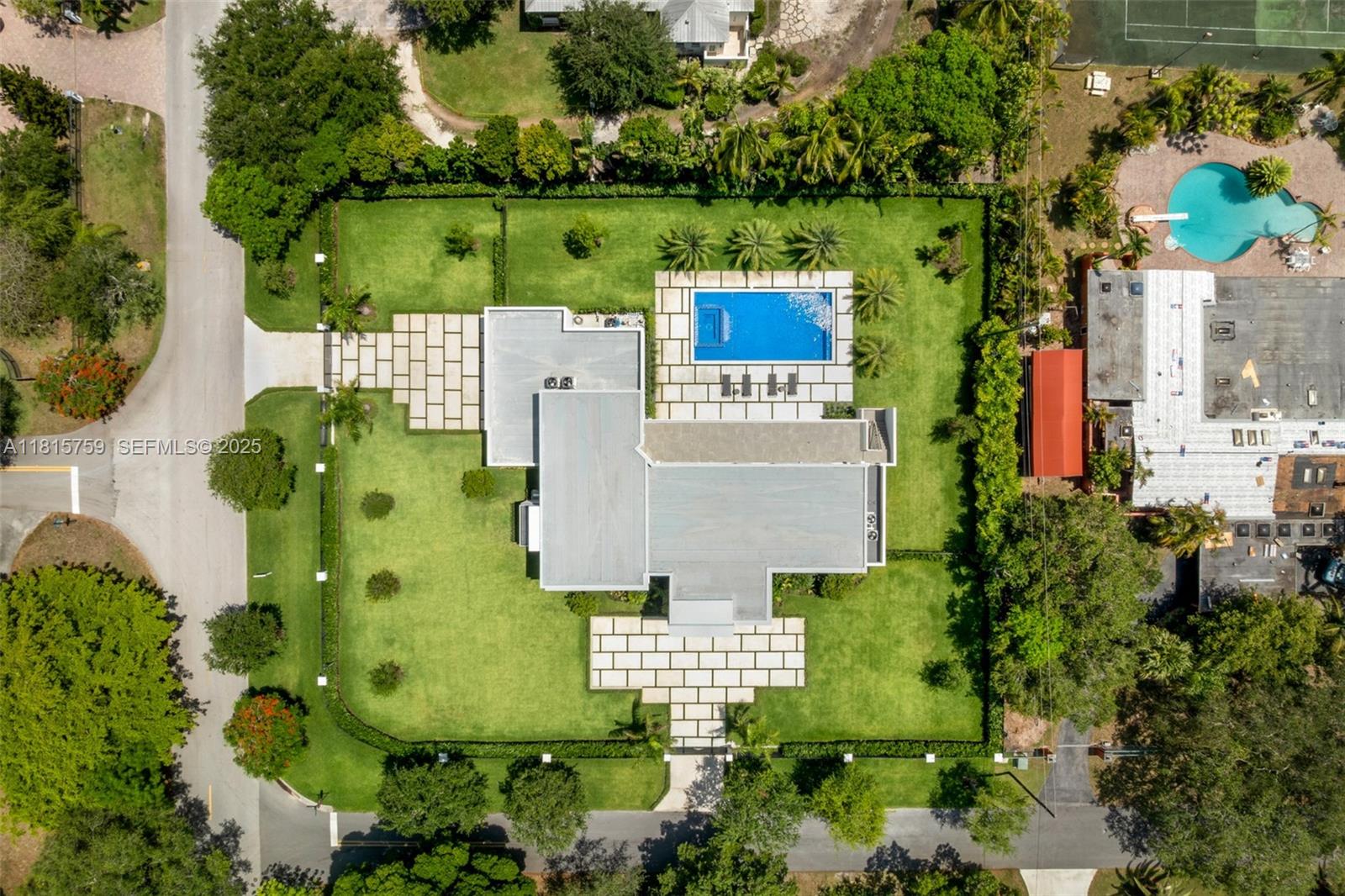 6200 Moss Ranch Road Pinecrest, FL 33156 - Photo 49 of 58 an aerial view of a house with a garden
