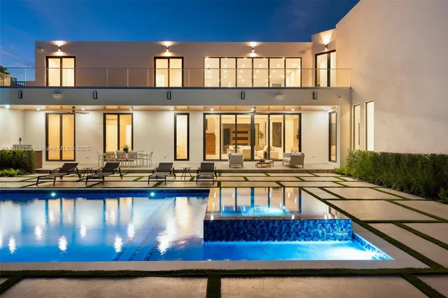 a living room with furniture and large window