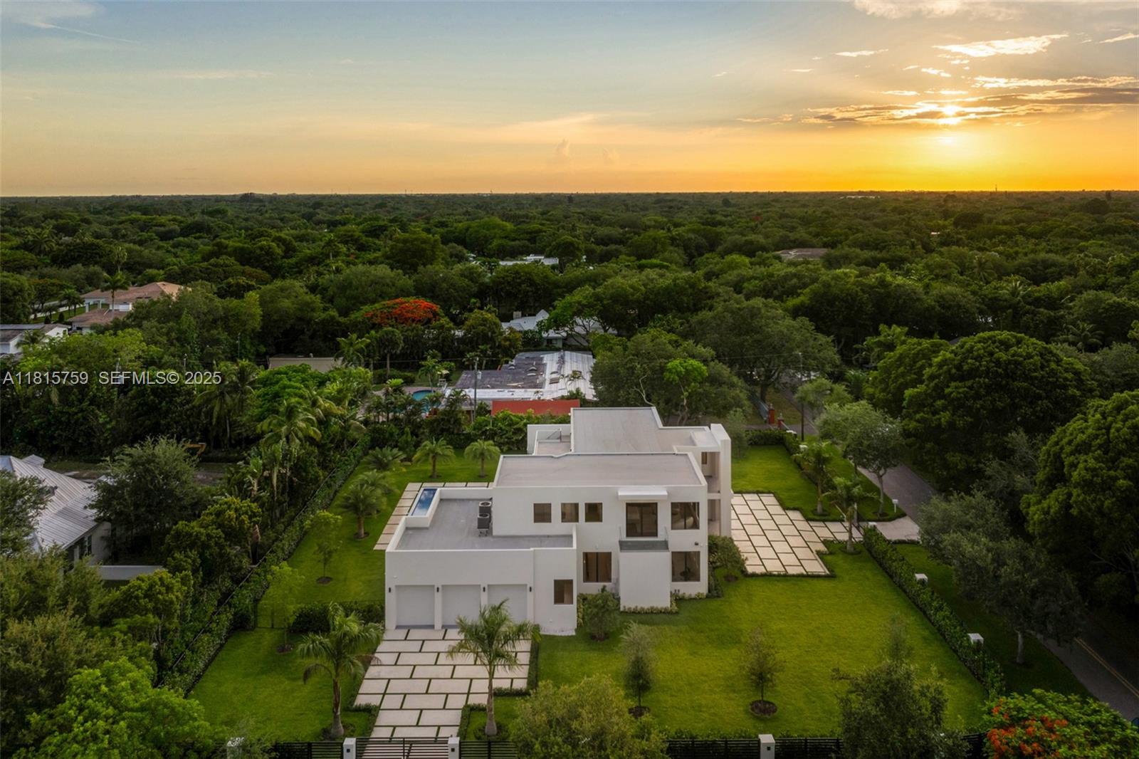6200 Moss Ranch Road Pinecrest, FL 33156 - Photo 57 of 58 a view of a house with a yard