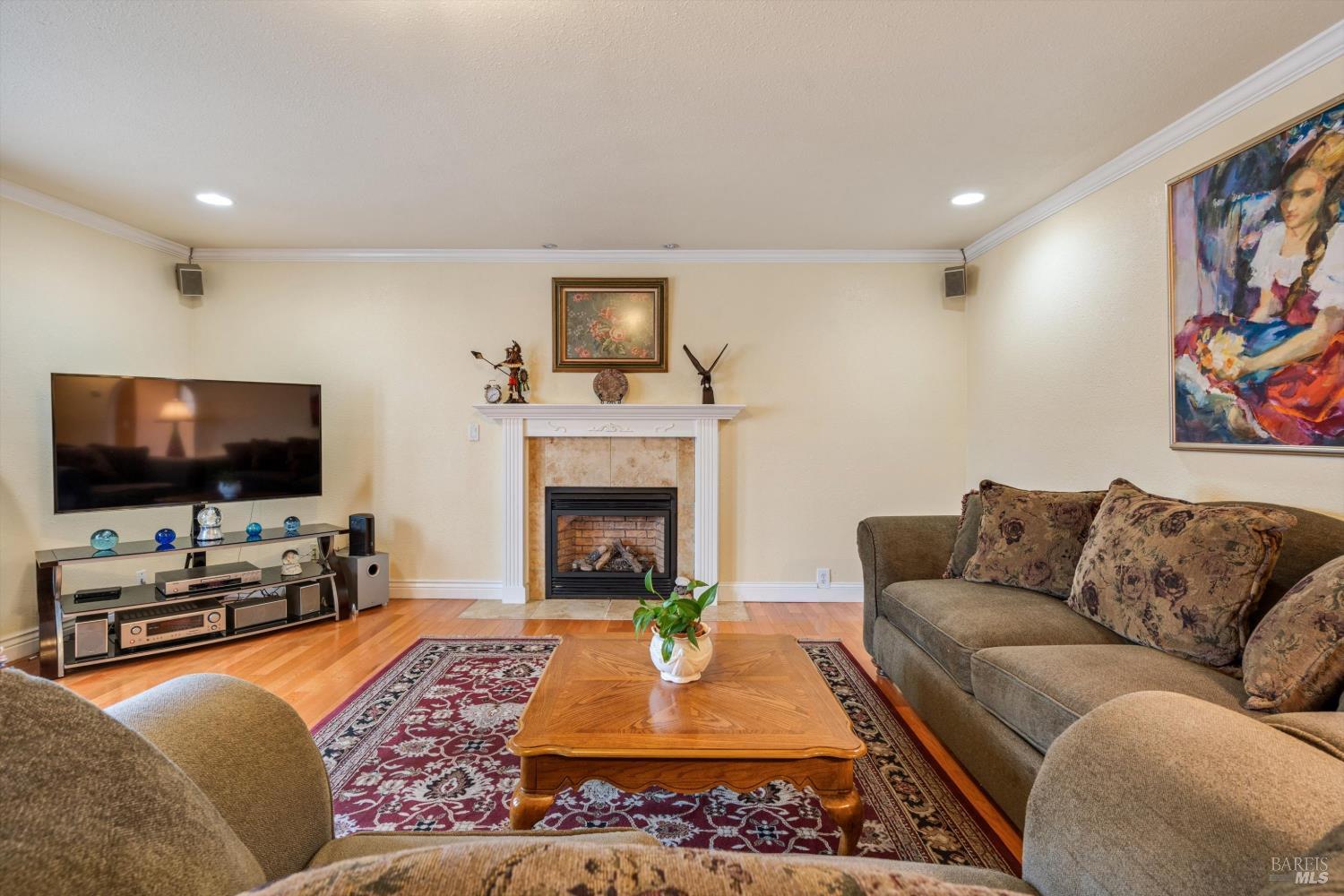 971 Eleanor Avenue Rohnert Park, CA 94928 - Photo 12 of 25 a living room with furniture and a flat screen tv
