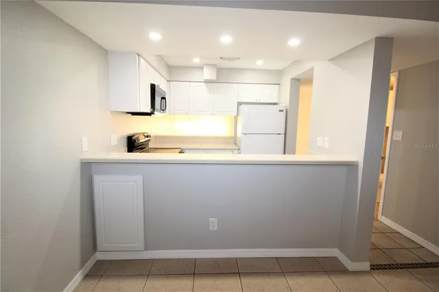 a bathroom with a sink a mirror and a shower