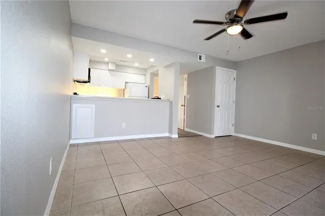 a view of a kitchen with a sink and cabinets