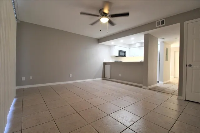 a view of a kitchen with a sink and a stove top oven