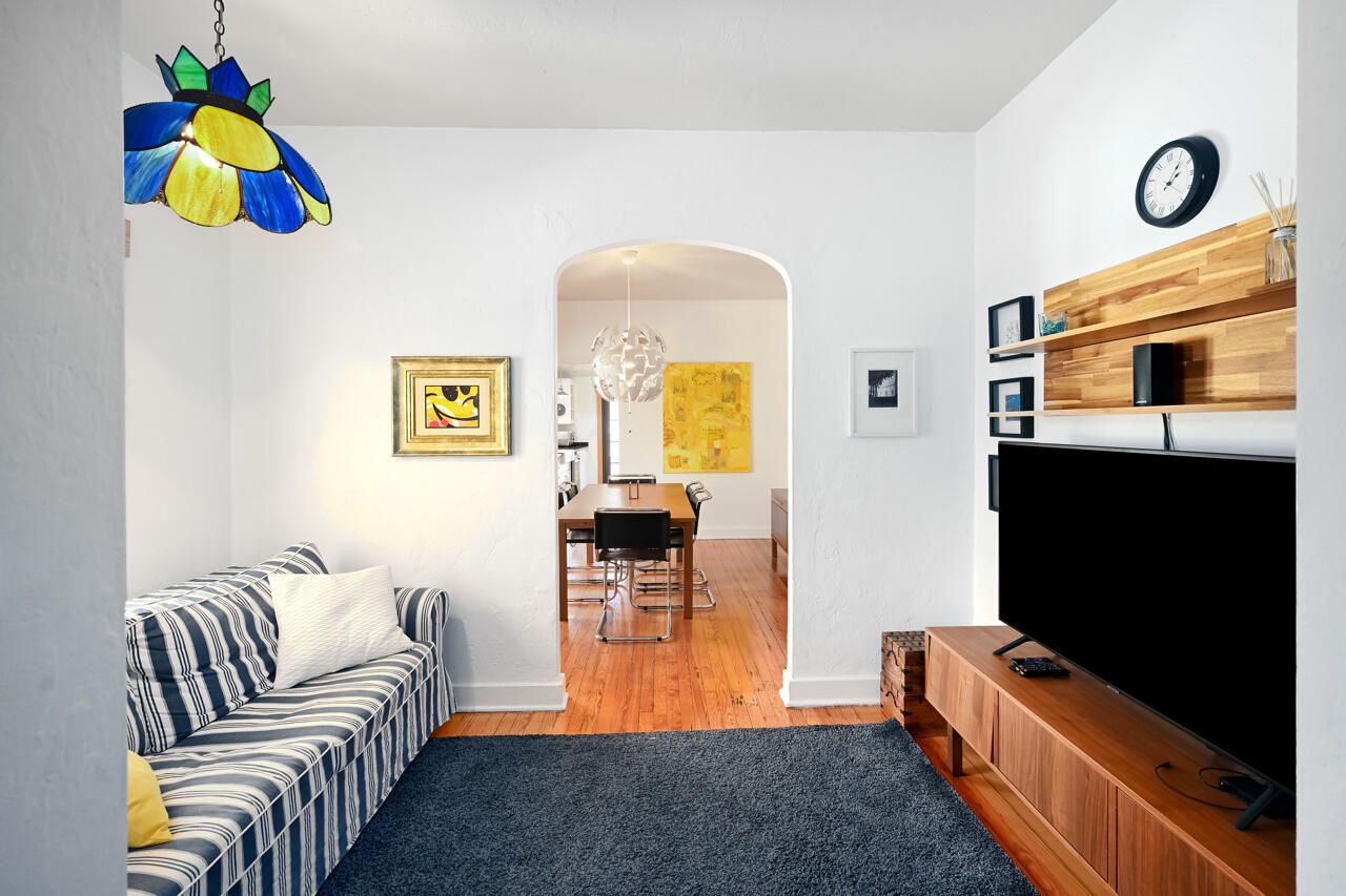 801 Hibiscus Street Boca Raton, FL 33486 - Photo 13 of 60 a living room with furniture and a flat screen tv