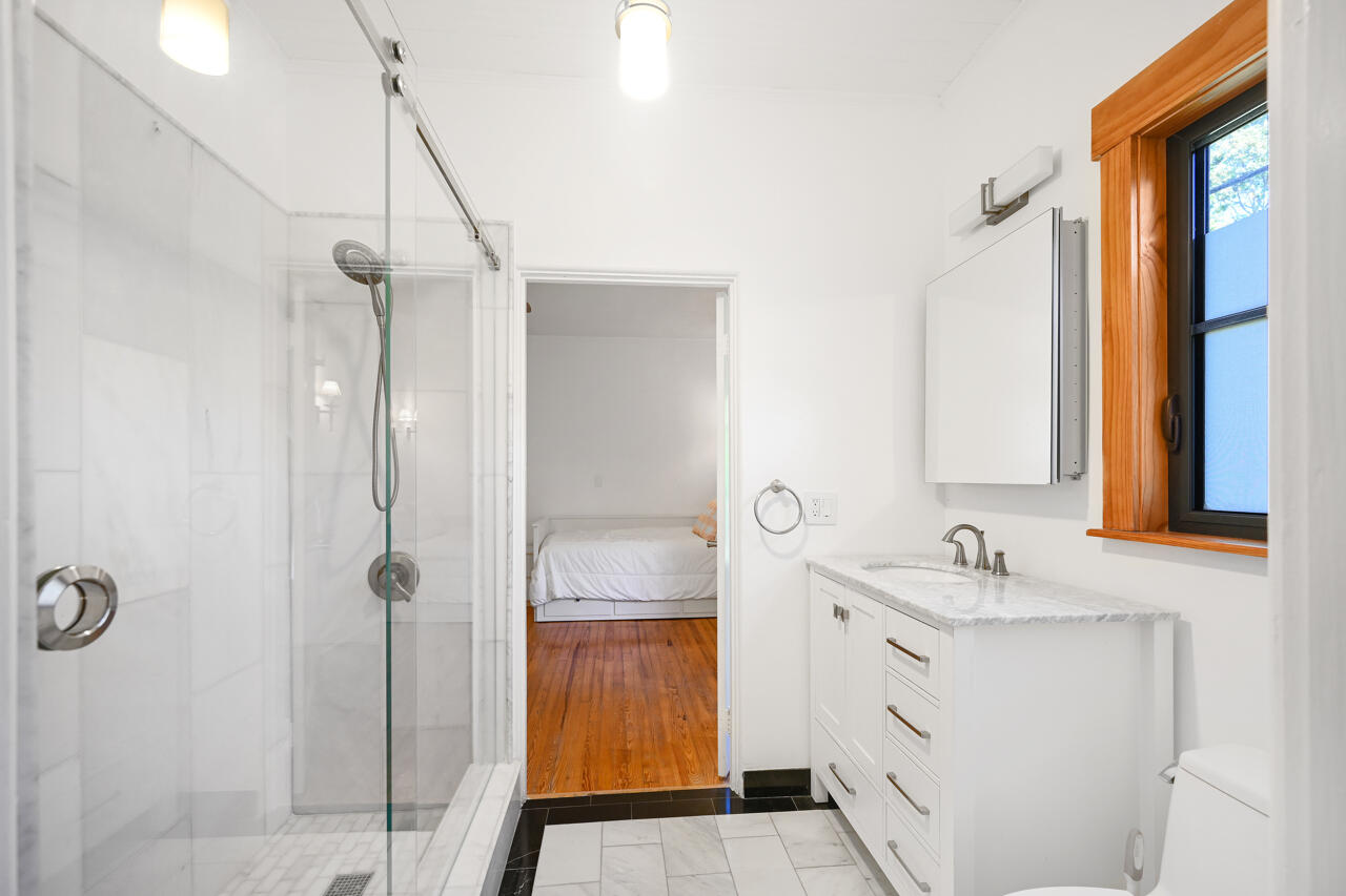 801 Hibiscus Street Boca Raton, FL 33486 - Photo 24 of 60 a bathroom with a sink a toilet and shower