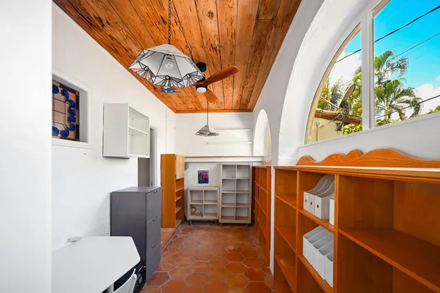 a bedroom with a large bed and a dresser