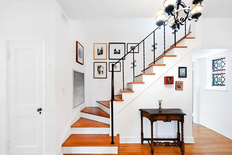 a living room with a flat screen tv and a fireplace