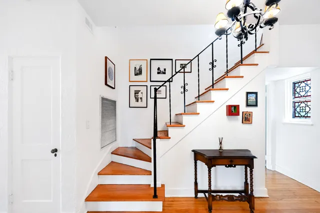a living room with a flat screen tv and a fireplace