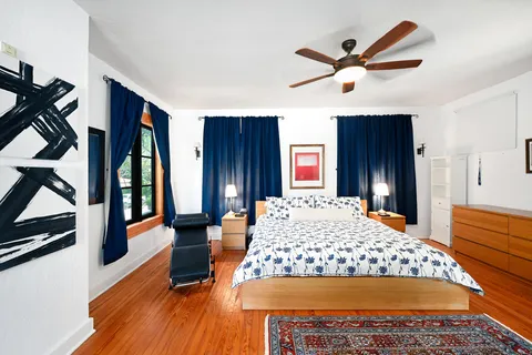 a view of a house with swimming pool and a yard