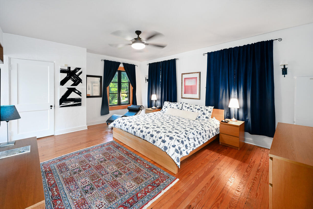 801 Hibiscus Street Boca Raton, FL 33486 - Photo 31 of 60 a bedroom with a large bed and a dresser