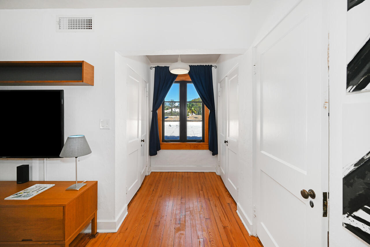 801 Hibiscus Street Boca Raton, FL 33486 - Photo 33 of 60 a living room with a flat screen tv and a fireplace