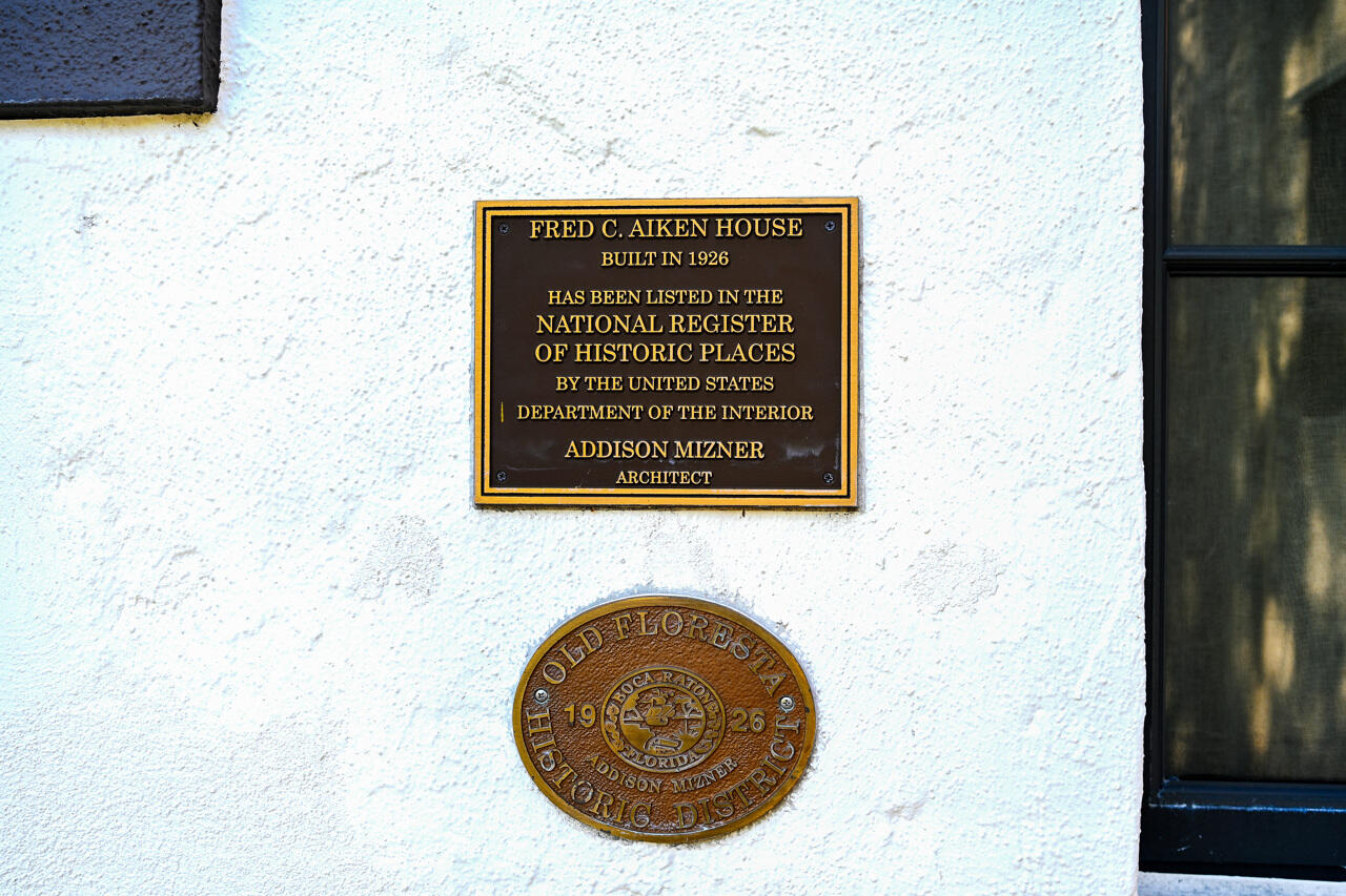 801 Hibiscus Street Boca Raton, FL 33486 - Photo 4 of 60 a sign that is on the side of a wall