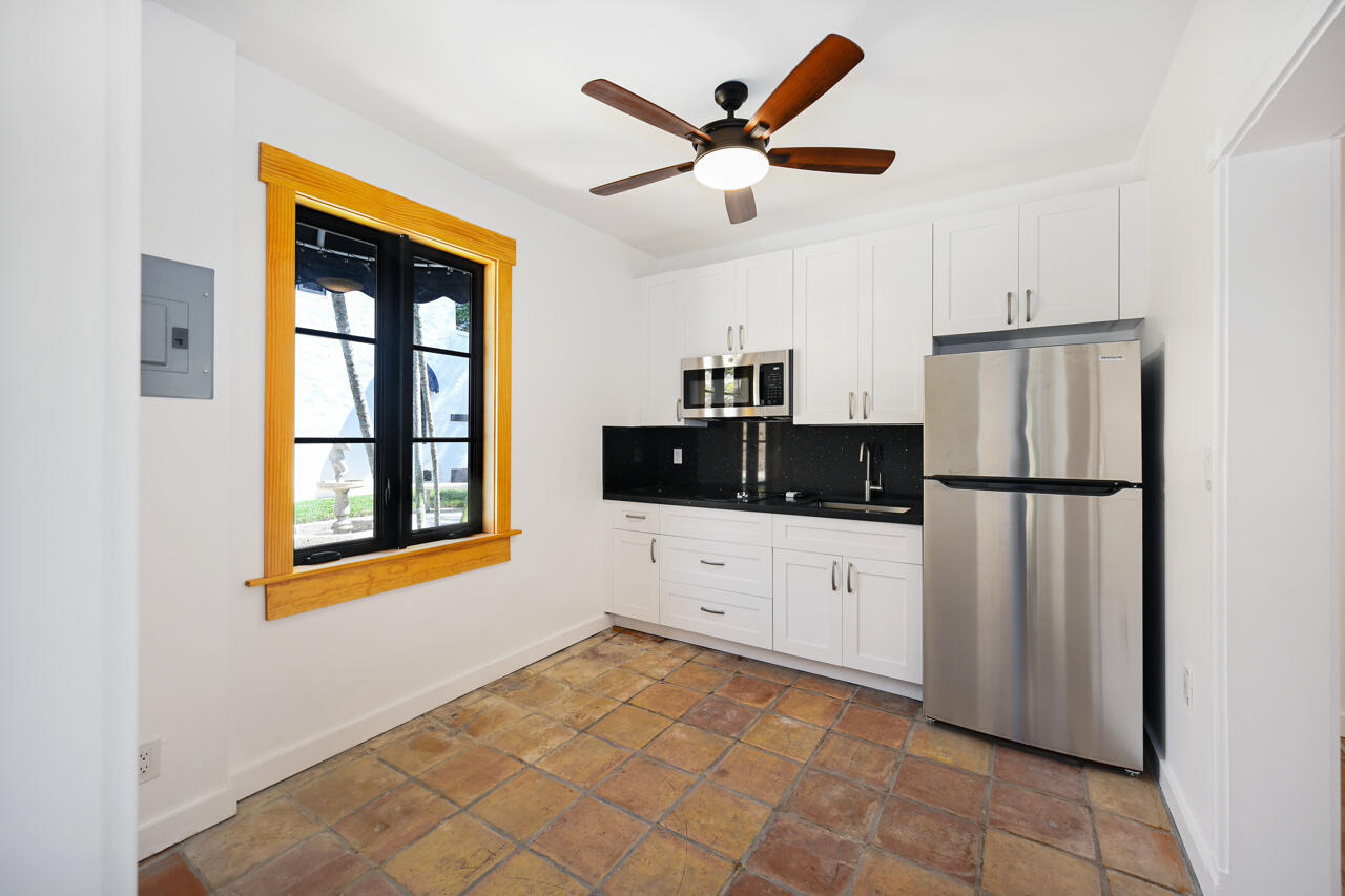 801 Hibiscus Street Boca Raton, FL 33486 - Photo 45 of 60 a kitchen with stainless steel appliances a refrigerator sink and cabinets