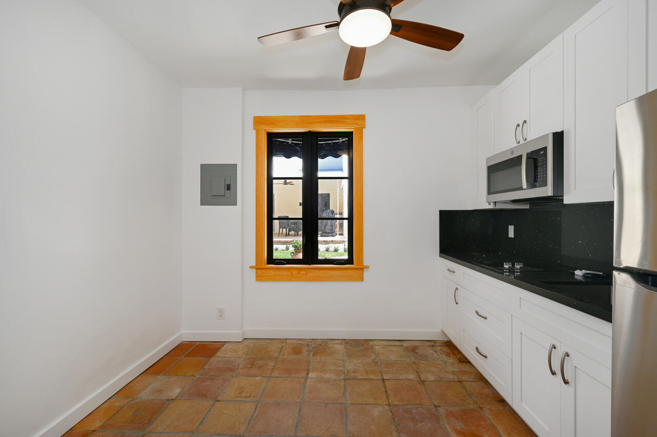 801 Hibiscus Street Boca Raton, FL 33486 - Photo 46 of 60 a hallway with windows and microwave