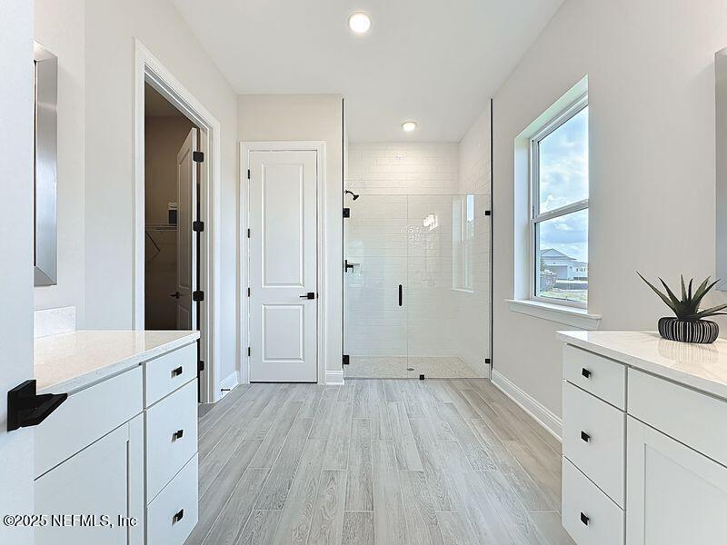 92 Bedford Terrace, Unit 60 St. Augustine, FL 32092 - Photo 18 of 42 a view of a hallway with wooden floors and cabinet