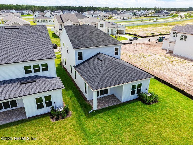 92 Bedford Terrace, Unit 60 St. Augustine, FL 32092 - Photo 27 of 42 an aerial view of a house with a garden and pool
