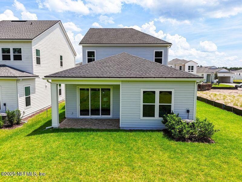 92 Bedford Terrace, Unit 60 St. Augustine, FL 32092 - Photo 28 of 42 a front view of a house with garden