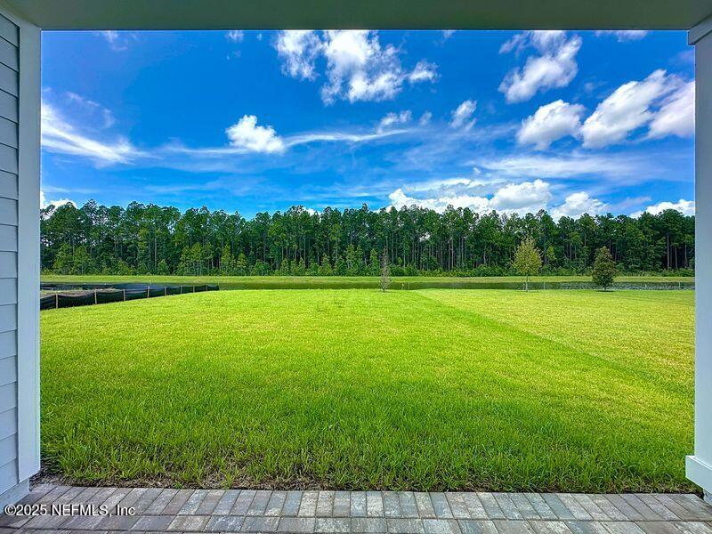 92 Bedford Terrace, Unit 60 St. Augustine, FL 32092 - Photo 4 of 42 a view of a green yard