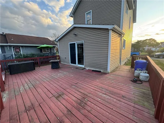 a view of house with deck outdoor seating