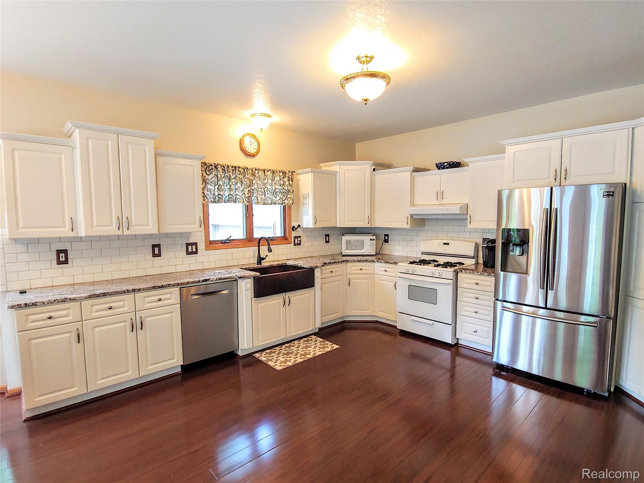 21109 Northline Road Taylor, MI 48180 - Photo 5 of 34 Huge Kitchen - Granite Counters - Farm Sink - Tons of Cupboards!