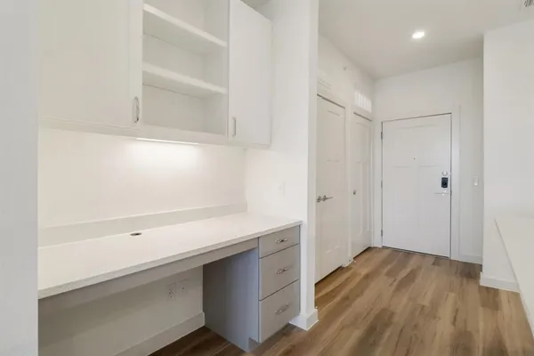 a view of cabinets with wooden floor