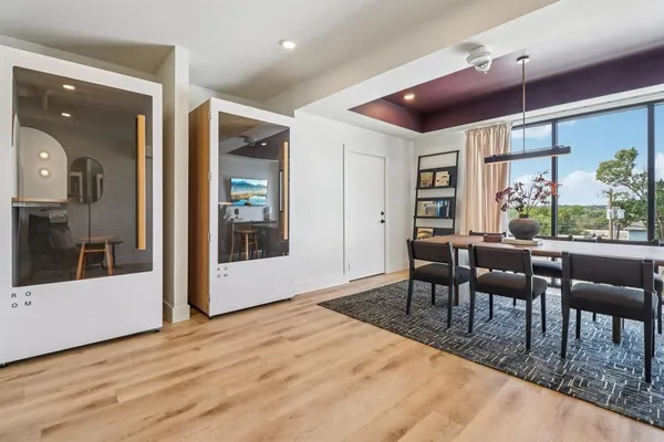 a view of a dining room with furniture window and wooden floor