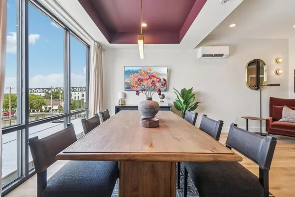 a view of a dining room with furniture window and outside view