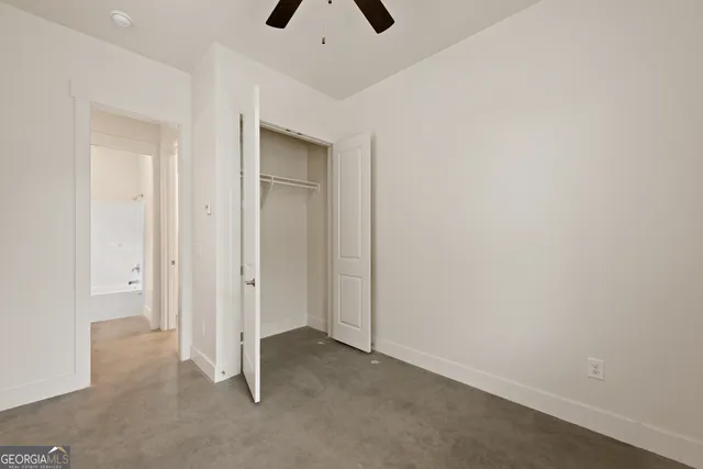 a bathroom with a toilet and a bathtub