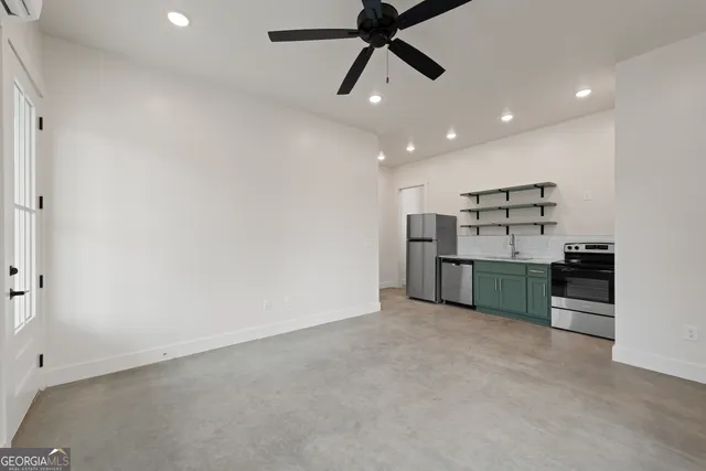 a kitchen with a sink and stainless steel appliances