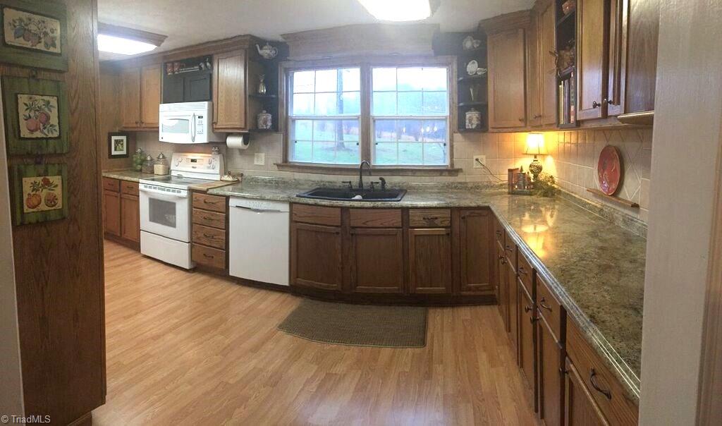 1085 Fish Pond Road Westfield, NC 27053 - Photo 14 of 30 Large kitchen with an abundance of cabinets and storage space.