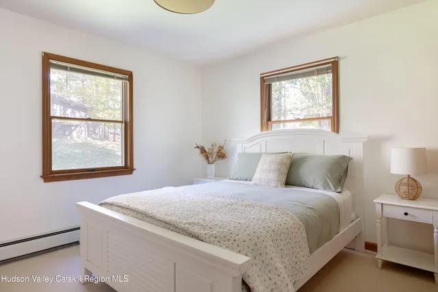 a bathroom with a toilet sink vanity tub and shower