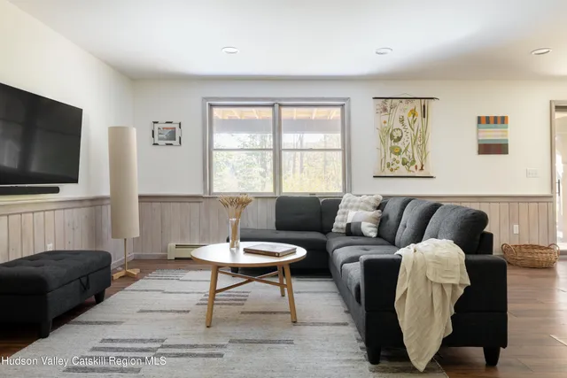 a view of a livingroom with furniture and a fireplace