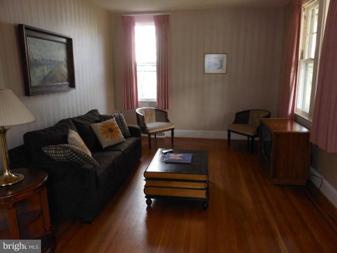 616 North Bend Road Baltimore, MD 21229 - Photo 2 of 18 a living room with furniture and wooden floor