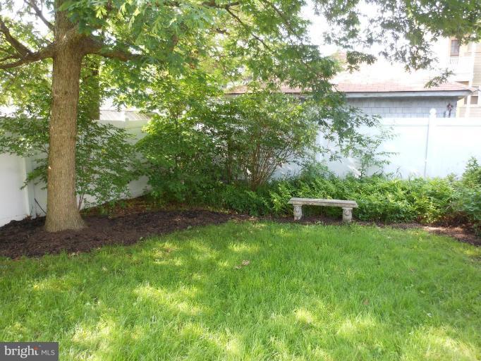 616 North Bend Road Baltimore, MD 21229 - Photo 11 of 18 a view of a backyard with a bench