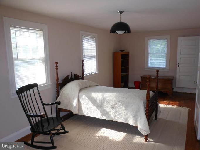 616 North Bend Road Baltimore, MD 21229 - Photo 14 of 18 a bedroom with a bed chair and window
