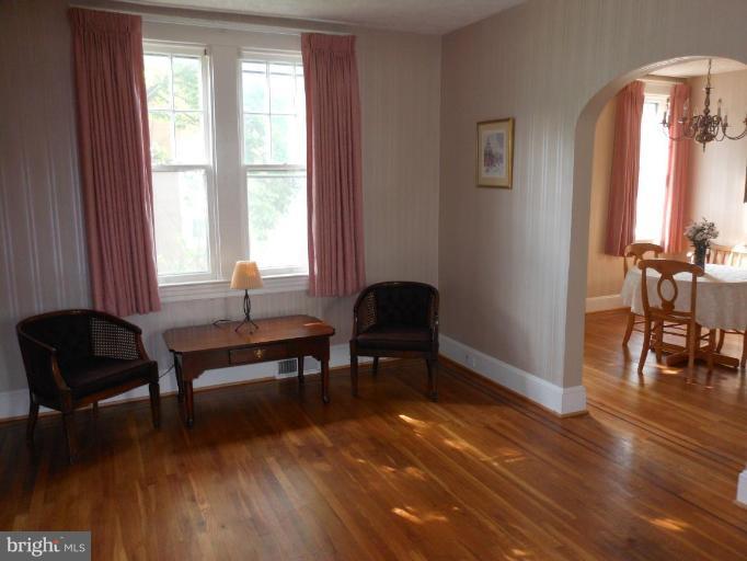 616 North Bend Road Baltimore, MD 21229 - Photo 5 of 18 a living room with furniture and a wooden floor